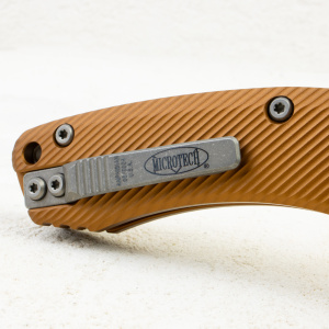 Нож Microtech Amphibian RAM-LOK,  Apocalyptic, M390, Aluminum Fluted Tan, 137RL-10 Нож Microtech Amphibian RAM-LOK,  Apocalyptic, M390, Aluminum Fluted Tan, 137RL-10