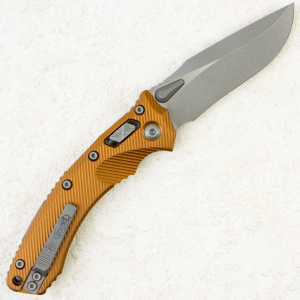 Нож Microtech Amphibian RAM-LOK,  Apocalyptic, M390, Aluminum Fluted Tan, 137RL-10 Нож Microtech Amphibian RAM-LOK,  Apocalyptic, M390, Aluminum Fluted Tan, 137RL-10