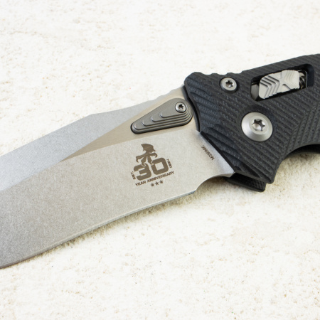 Нож Microtech Amphibian 30th Anniversary RAM-LOK,  Stonewash, M390, G10 Fluted Black, 137RL-10 Нож Microtech Amphibian 30th Anniversary RAM-LOK,  Stonewash, M390, G10 Fluted Black, 137RL-10