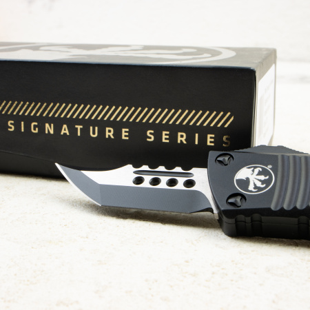 Нож Microtech Mini Troodon Hellhound, Tactical, M390, Aluminum Black, 819-1 TS, (Signature Series) Нож Microtech Mini Troodon Hellhound, Tactical, M390, Aluminum Black, 819-1 TS, (Signature Series)